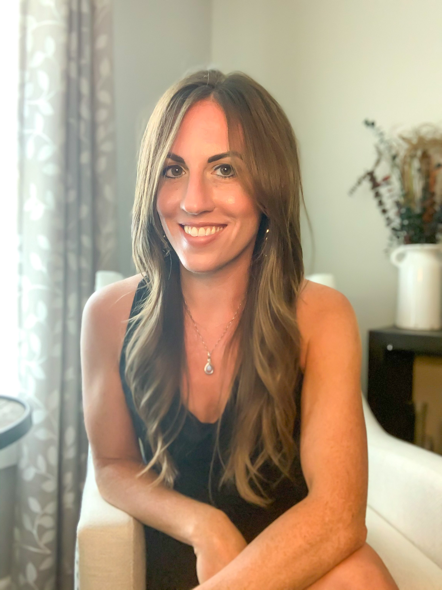 Lindsay smiling in her salon chair